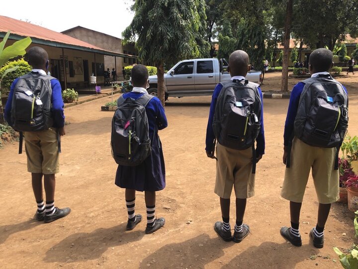 Children in Tanzania, set up to carry air pollution monitoring backpacks